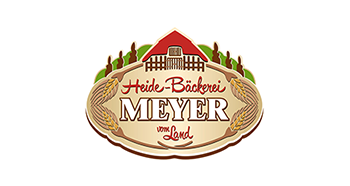 Logoillustration mit einem Häuschen und einem Schriftzug Heide-Bäckerei Meyer vom Land" title="Logo Bäckerei Meyer